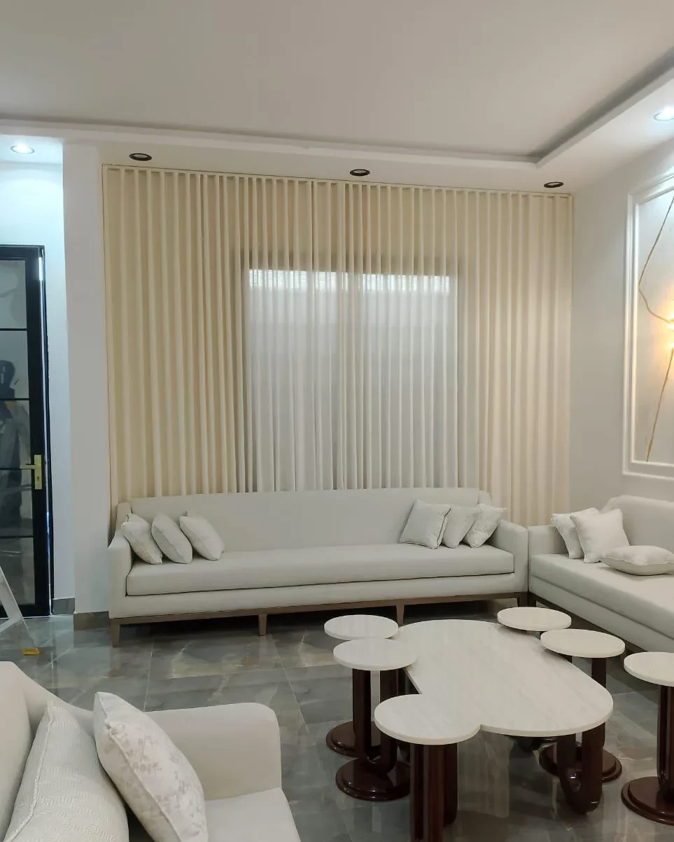 Custom wave curtains in a Riyadh living room by Prime Curtain Co