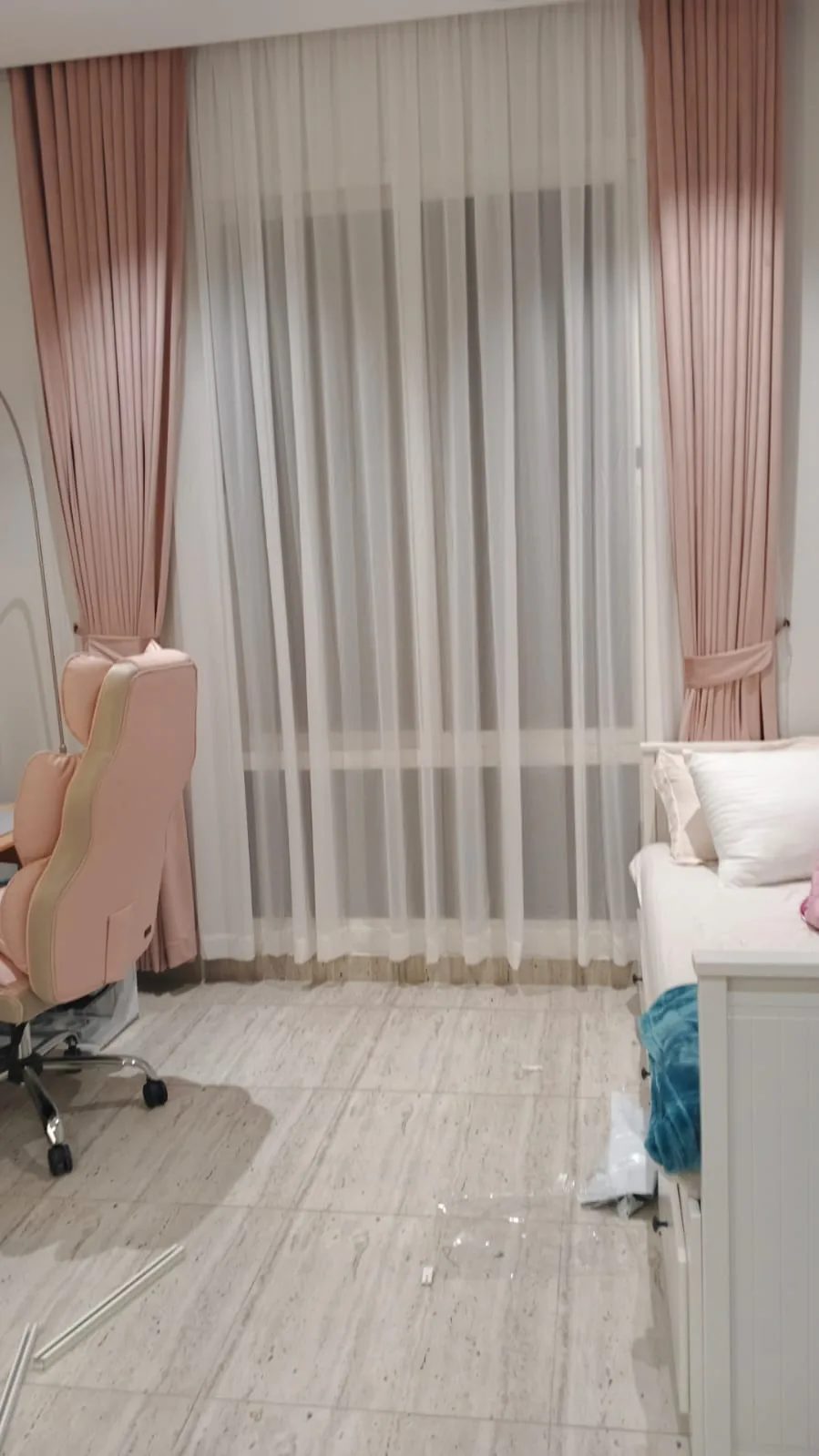 Soft blush bedroom curtains with warm light